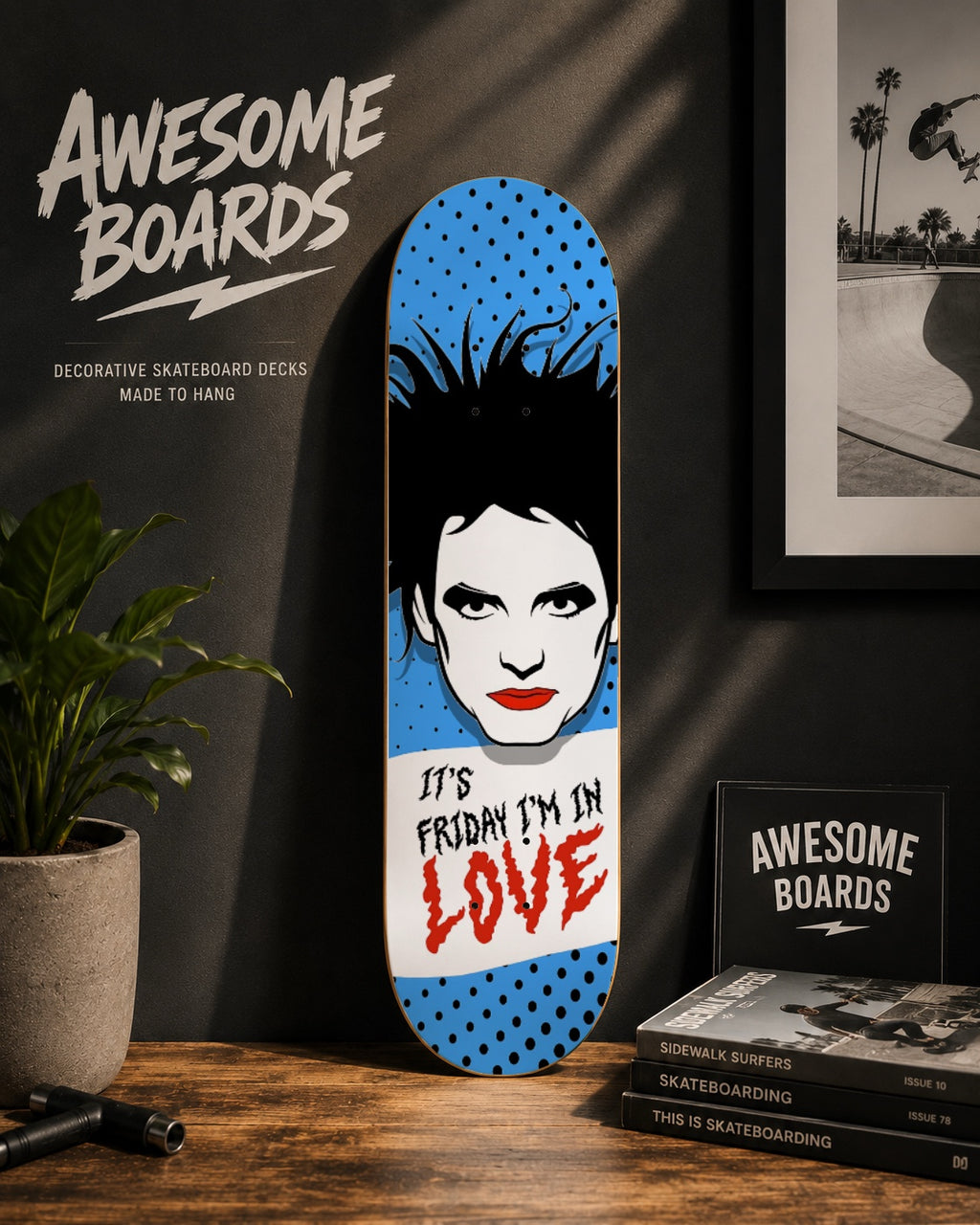 It's Friday I'm in Love decorative skateboard deck with blue pop art design, black dots and illustrated portrait